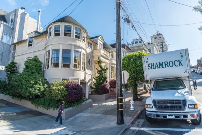 Shamrock truck at a San Francisco Victorian home